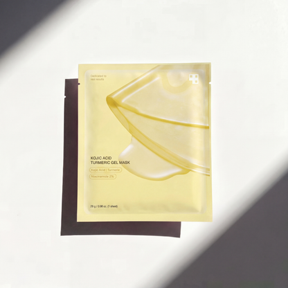 Thejijo Kojic Acid Turmeric Gold Collagen Mask spread on the skin, showing a bright, golden facial mask for skincare.