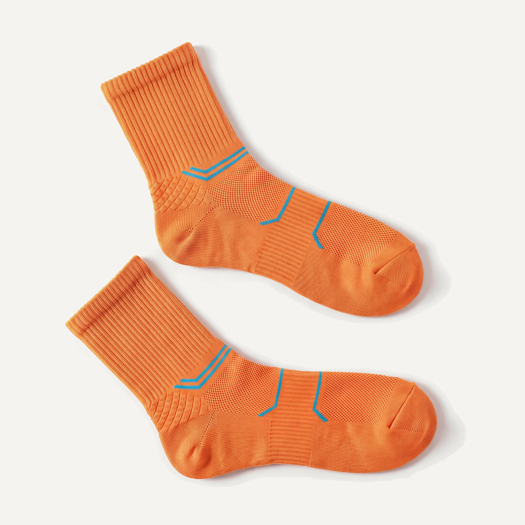 Crew Compression Socks in Orange, pair laid flat