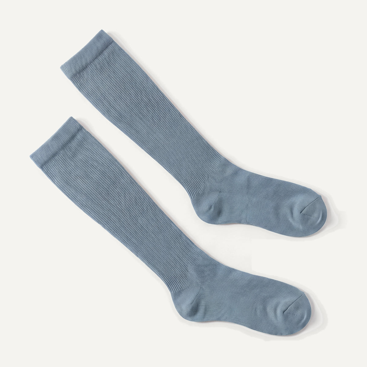 Knee-High Compression Socks in Dusty Blue, pair laid flat