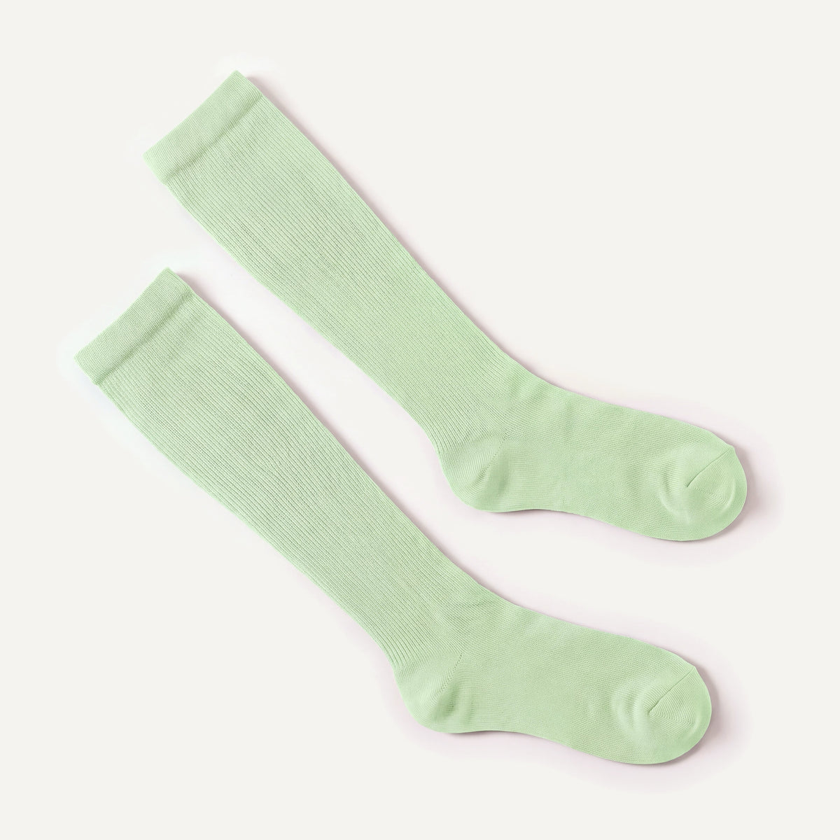 Knee-High Compression Socks in Mint, pair laid flat