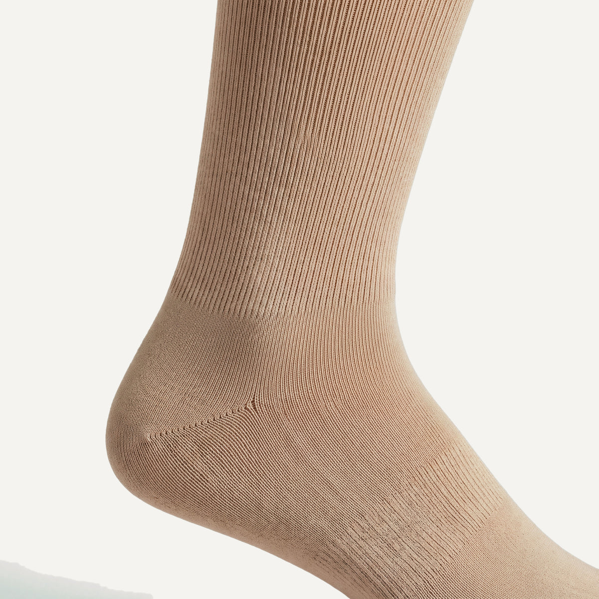 Knee-High Compression Socks in Nude, close-up of the knit