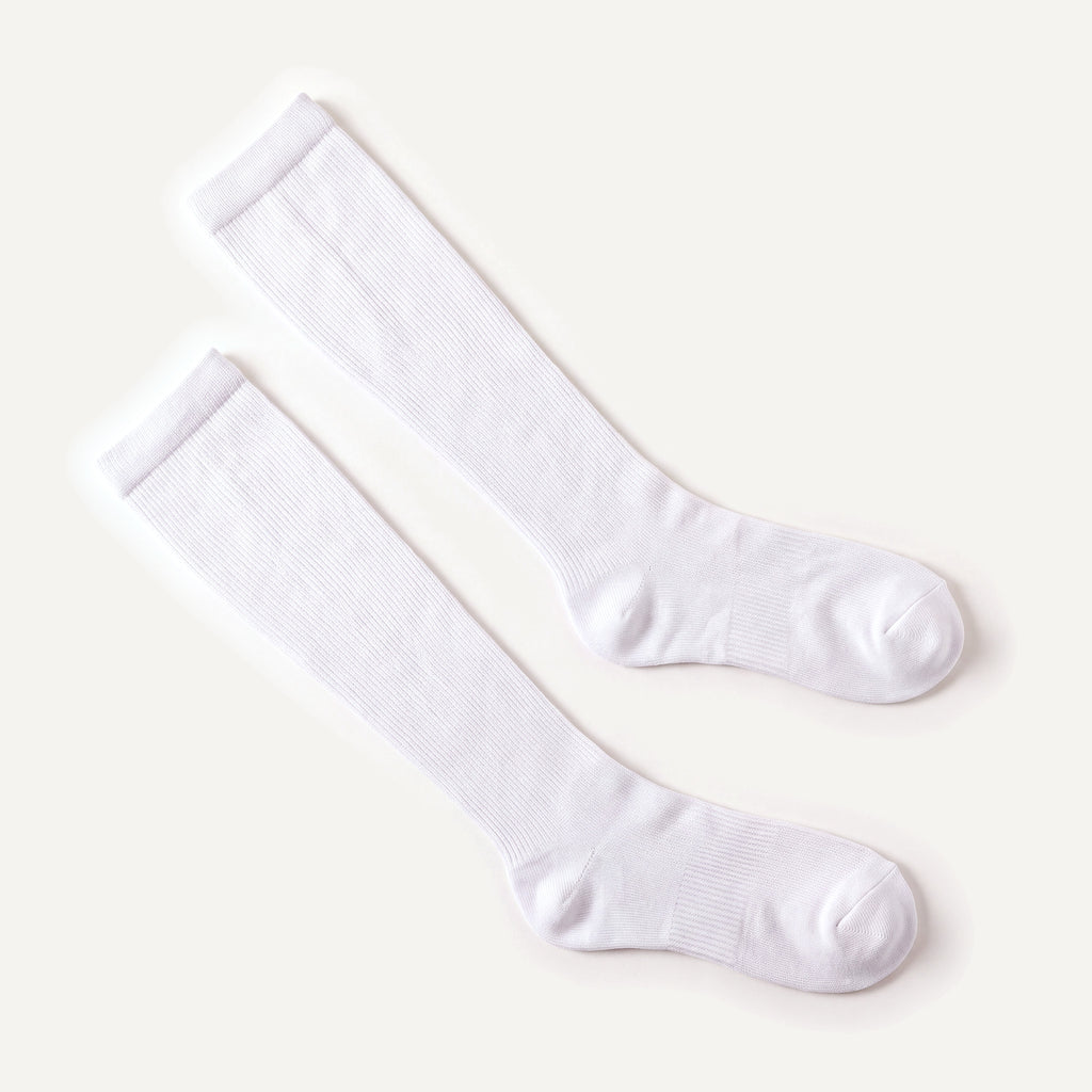 Knee-High Compression Socks in White, pair laid flat