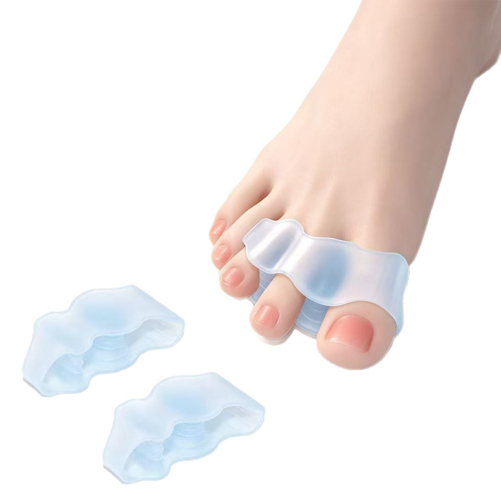 Toe Spacers in Clear, worn on the foot with two spare spacers