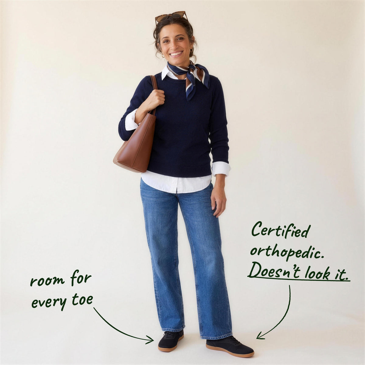 Ogni Vie in Black, worn with jeans, full-length view on a woman, with handwritten notes: room for every toe; certified orthopedic, doesn't look it
