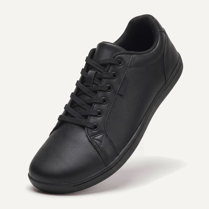 Pelle Vie in Black, standing on the toe, top view of the laces