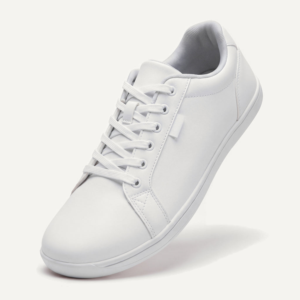 Pelle Vie in White, standing on the toe, top view of the laces