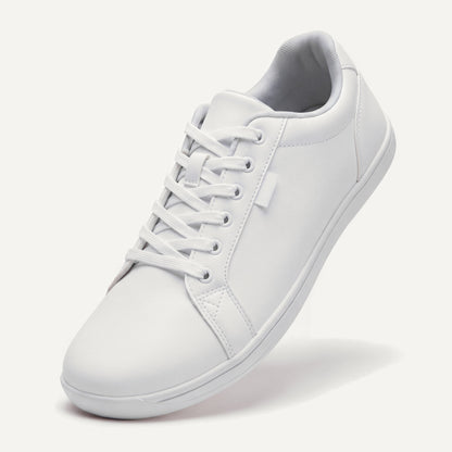 Pelle Vie in White, standing on the toe, top view of the laces